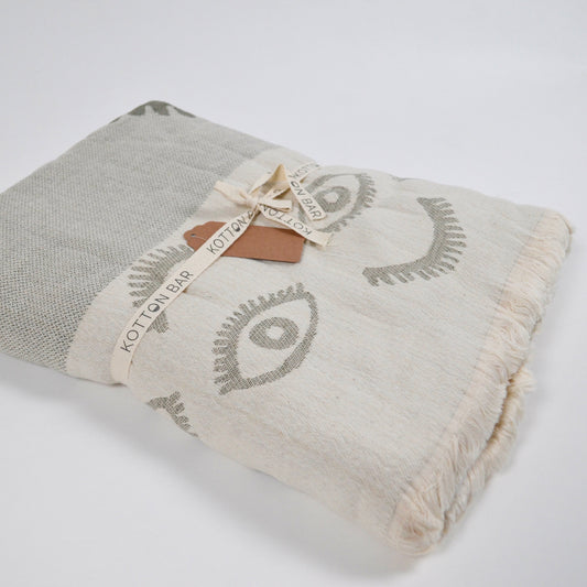 Folded fabric with decorative patterns on a white background
