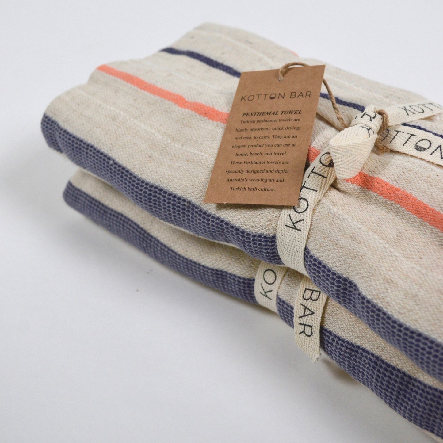 Stack of striped towels with a label on a white background