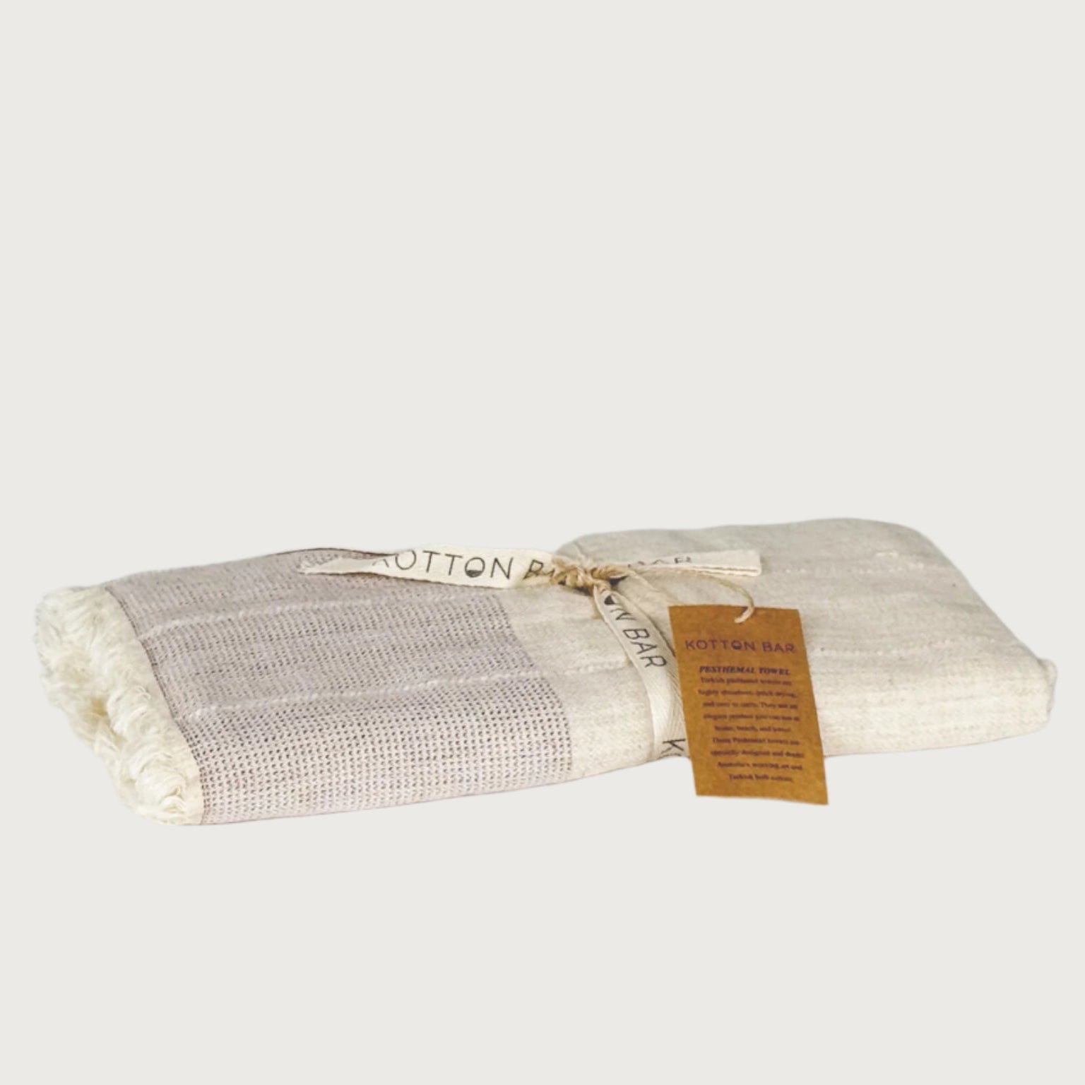 Folded fabric with a label on a gray background