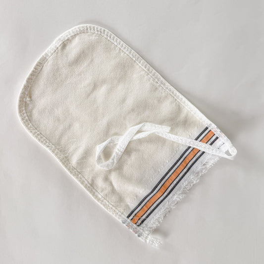 white exfoliator glove